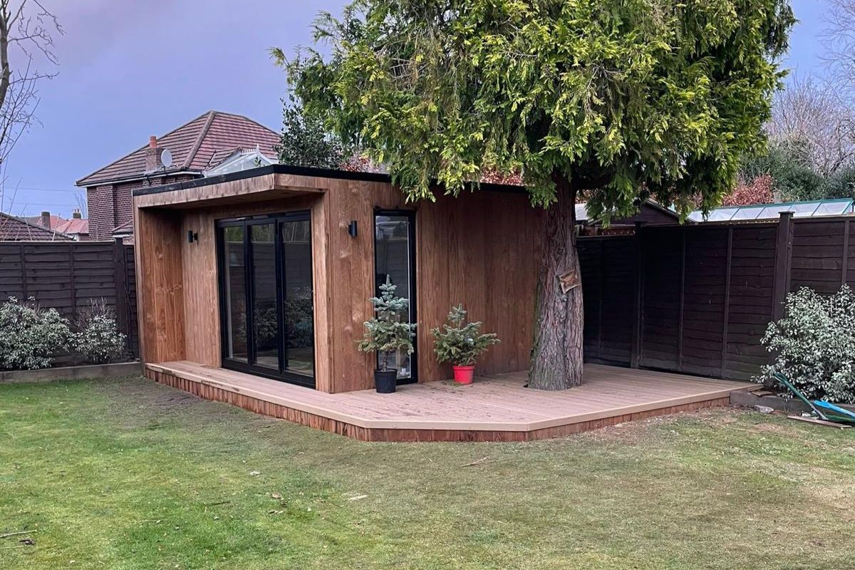 light wood garden room office with decking