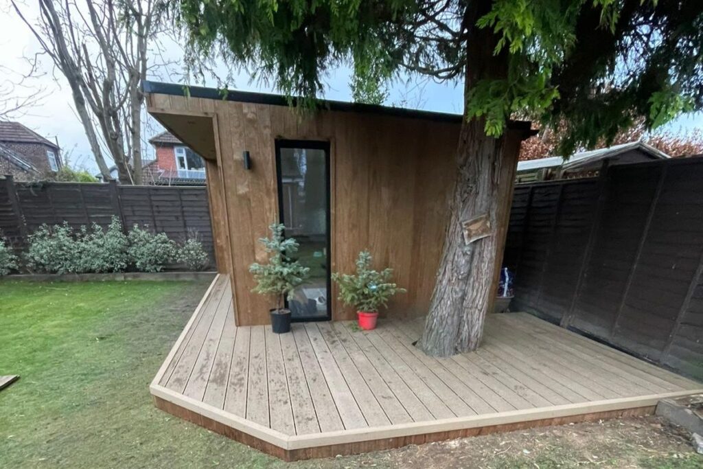 light wood insulated garden room office with decking