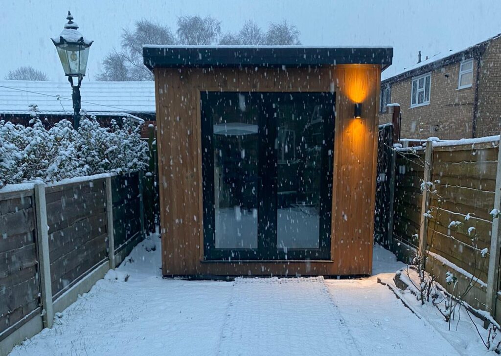 small garden room in the snow