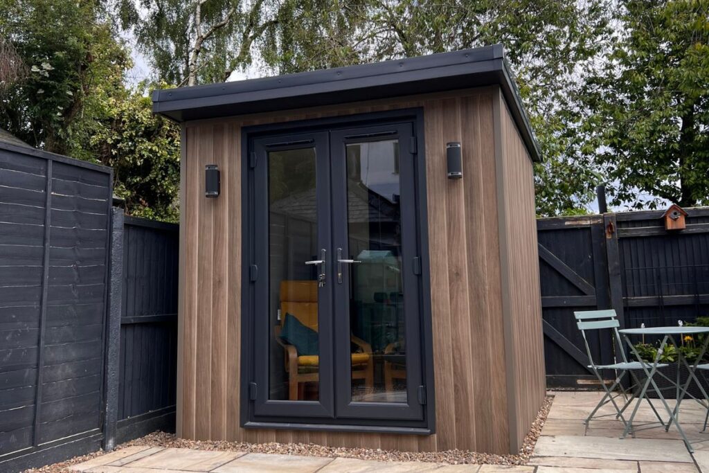 small garden room with doors and lighting