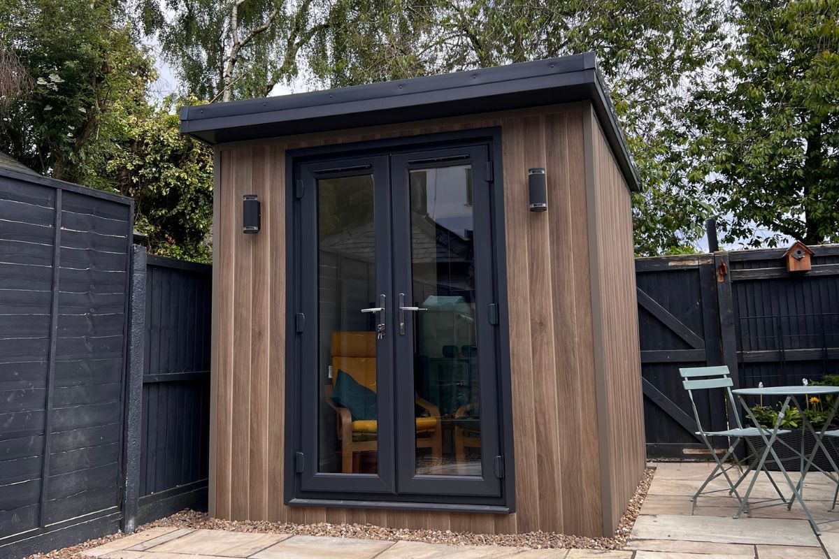 small garden room bar with doors and lighting