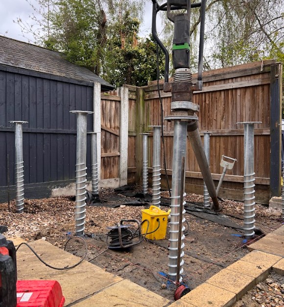 ground screw foundations for small garden room bar